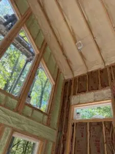Commercial Insulation 16 Spray foam insulation installed between vaulted ceiling rafters by Greenshield Insulation in Southwest Michigan