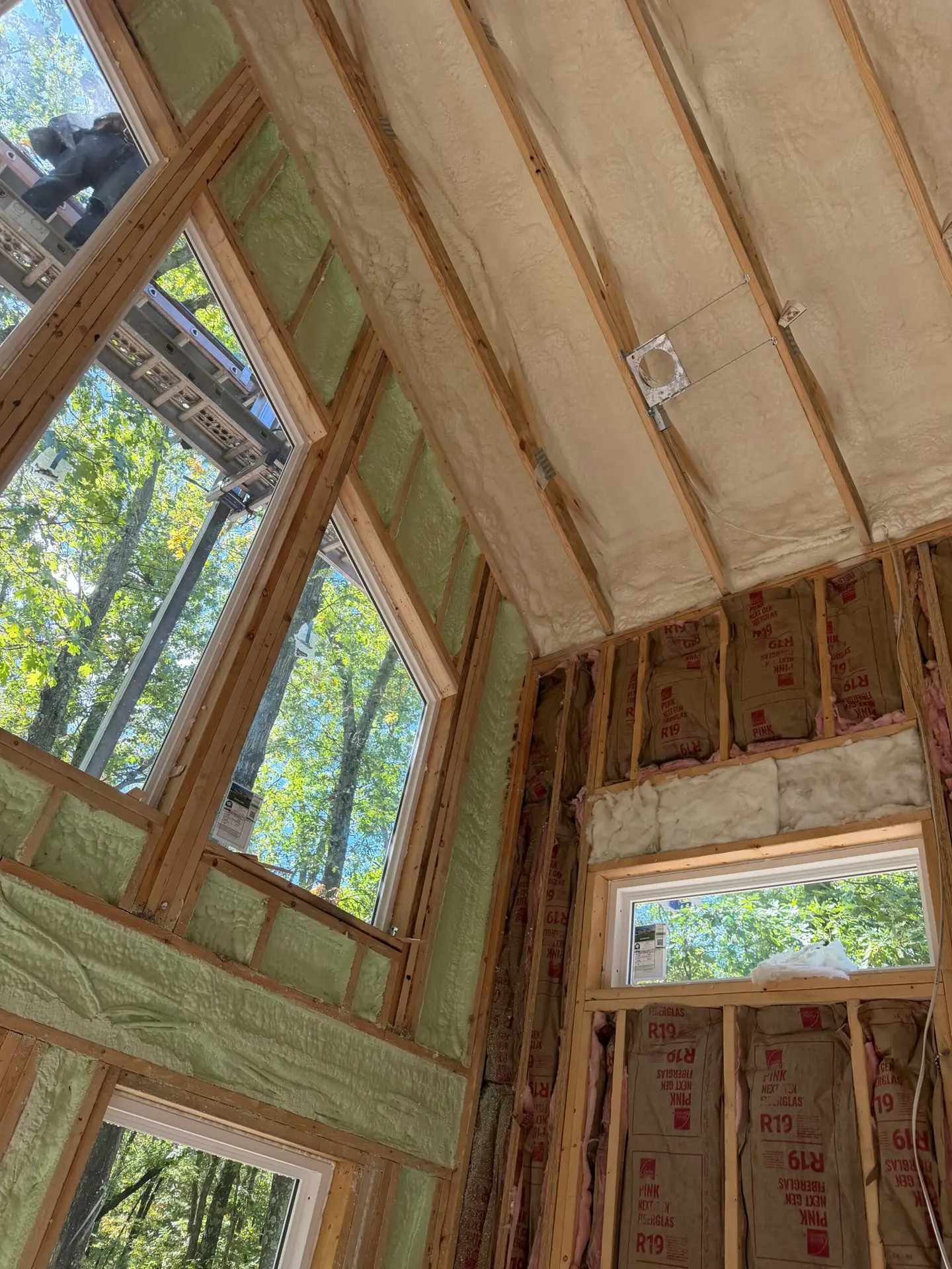 Spray foam insulation installed between vaulted ceiling rafters by Greenshield Insulation in Southwest Michigan